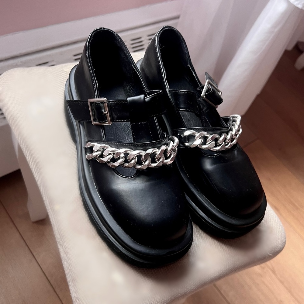 Black faux leather chain loafers